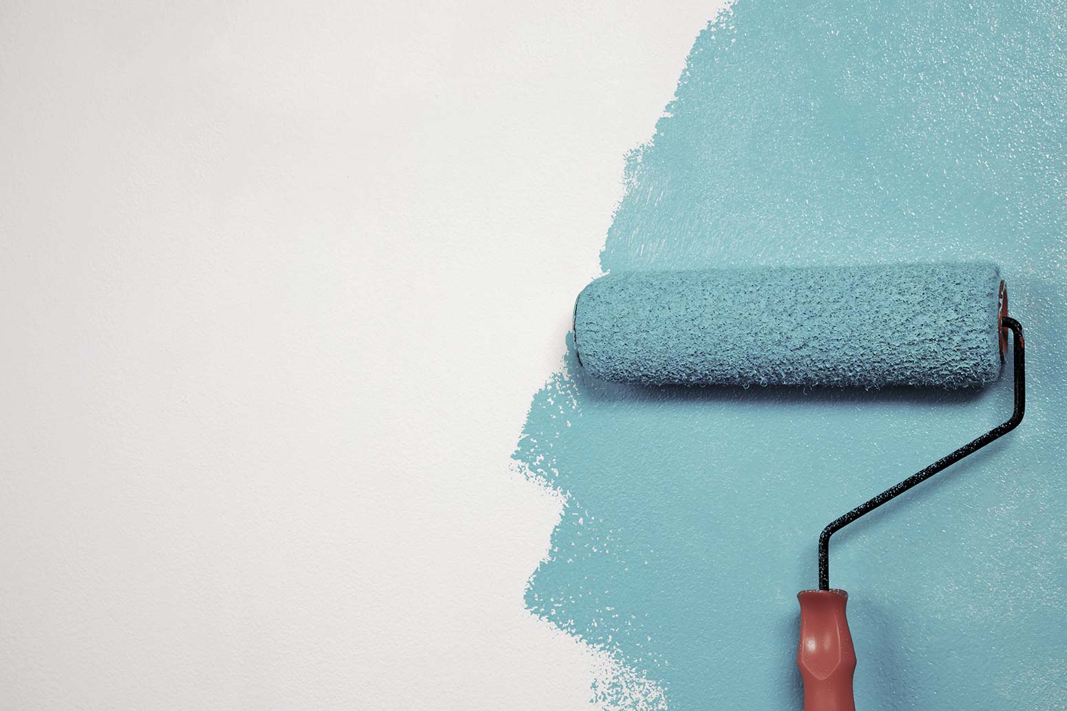 Paint roller adding blue paint to a white background