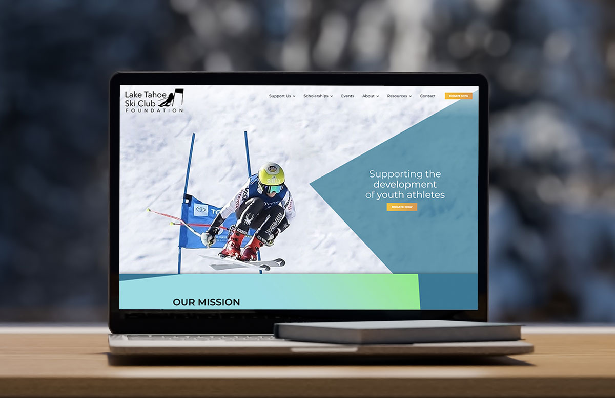 Lake Tahoe Ski Club Foundation website on a laptop screen in front of snowy window