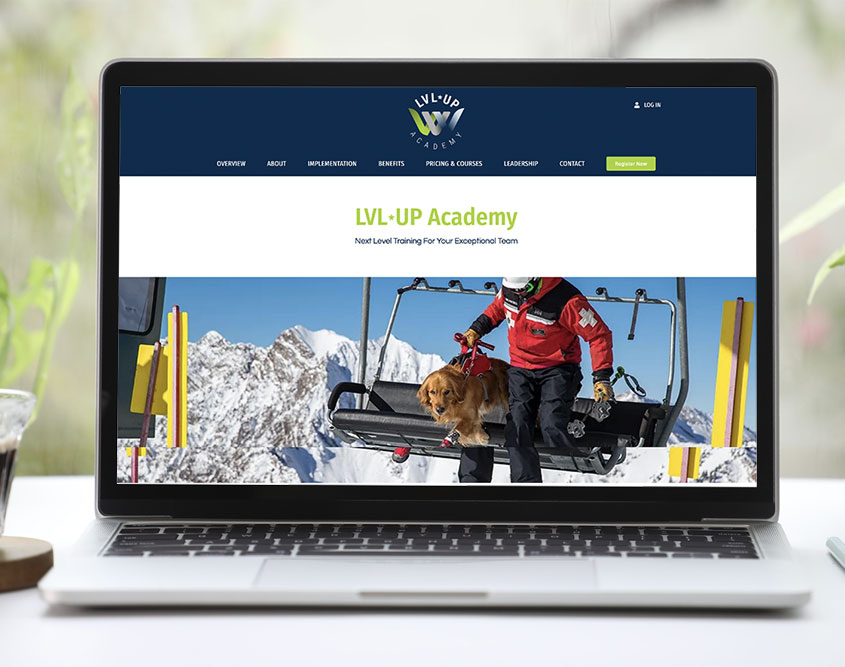 LVL UP Academy website on a laptop in front of a window