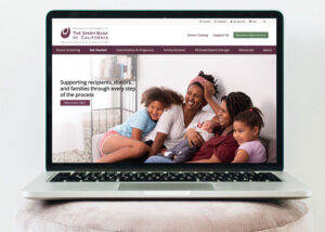 The Sperm Bank of California website on a laptop sitting on a pink stool.