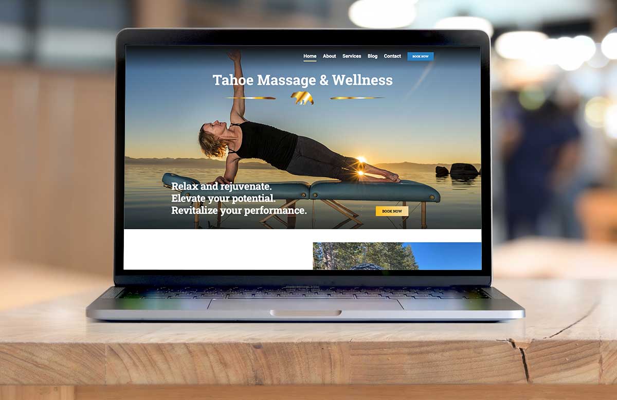 computer on a table with tahoe massage and wellness website on screen